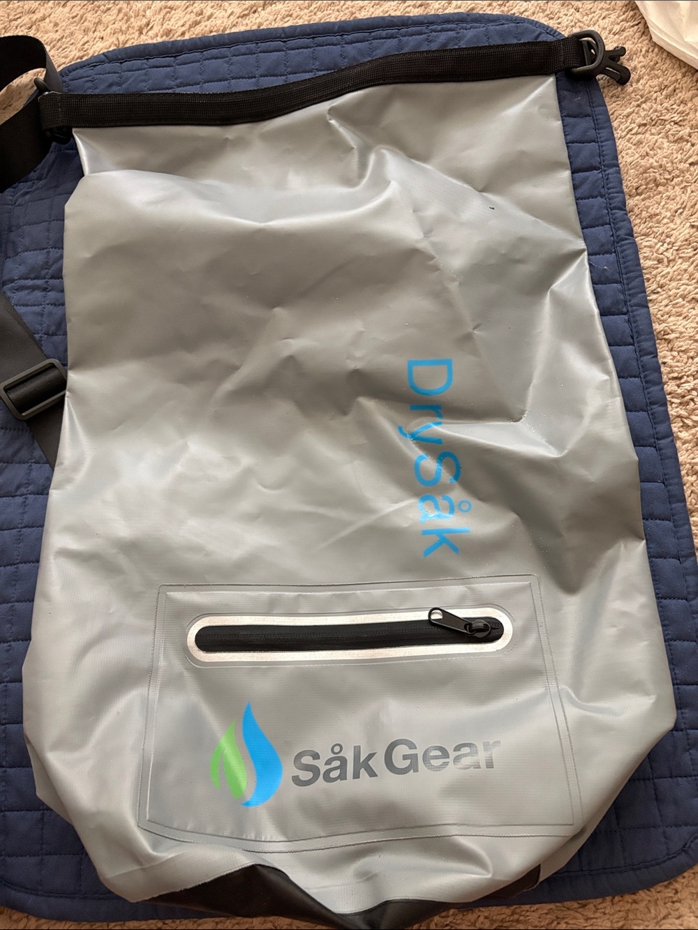 DrySak Waterproof Roll-Top Bag in Light Gray with Blue Logo